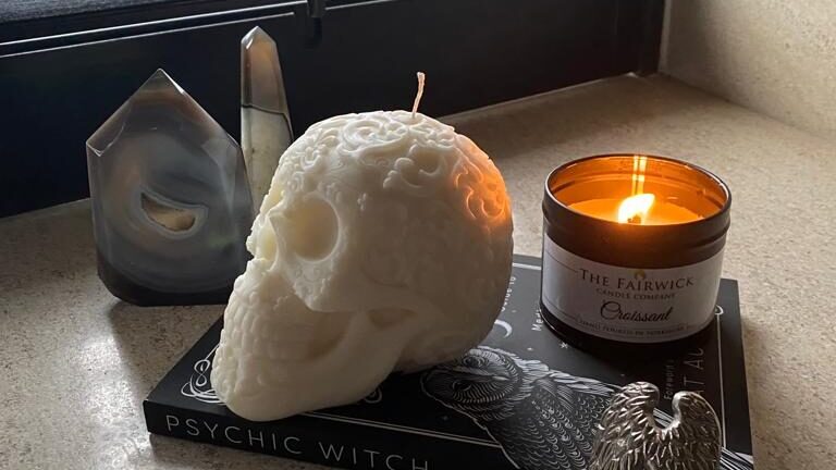 ornate skull candle with Croissant scented candle